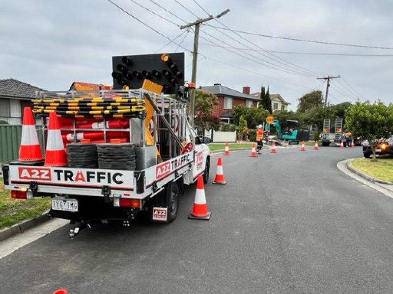A2Z Traffic vehicle deployed on a residential street with cones and signage in place, actively managing a safe work zone during local infrastructure or utility works in suburban Melbourne.